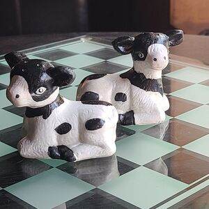 Salt & Pepper Shakers Is ceramic Cows black and white for sale.